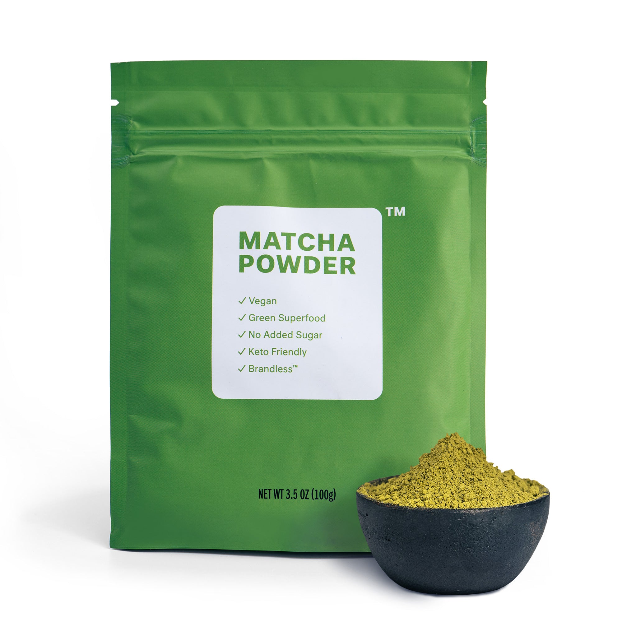Matcha powder.  Product photo of bag with powder in bowl in foreground.  Vegan, Green Superfood, No Added Sugar, Keto Friendly, Brandless.  Net weight 3.5oz (100g).